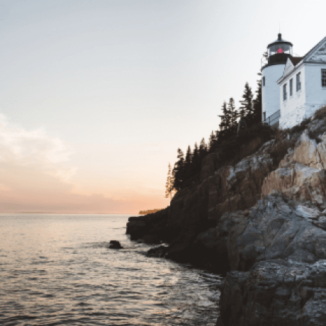 A lighthouse on the rocky coast of Maine